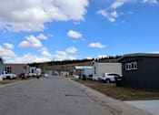 Thumbnail 8 of 8 - a row of mobile homes parked on the side of a road