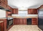Thumbnail 4 of 30 - Fully Equipped Eat-In Kitchen at Country Oaks, Texas
