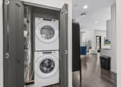 Thumbnail 18 of 50 - a washer and dryer in a closet in a living room
