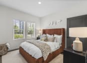 Thumbnail 12 of 50 - a bedroom with a large bed and two windows