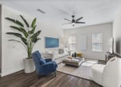 Thumbnail 10 of 50 - a living room with white furniture and a ceiling fan
