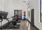 Thumbnail 44 of 50 - a home gym with exercise equipment and a window