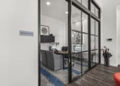 Thumbnail 48 of 50 - an office with a desk and a large glass door