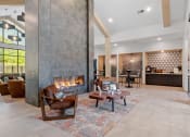 Thumbnail 23 of 76 - Clubhouse living room with fireplace at The Lodge at Overland, Rochester, MN, 55901