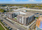 Thumbnail 1 of 57 - an aerial view of an apartment building in a city