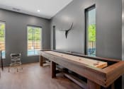 Thumbnail 37 of 76 - Tabletop shuffle board in our Game Room at The Lodge luxury apartments in Rochester MN