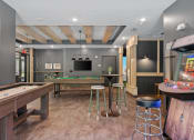 Thumbnail 38 of 76 - a games room with a pool table and foosball at The Lodge at Overland, Minnesota