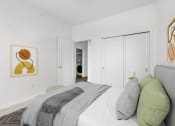 Thumbnail 15 of 83 - a bedroom with a large bed and a door to a hallway