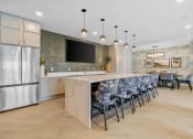 Thumbnail 31 of 62 - Clubroom with Kitchen Bar at The Aurilla, Cottage Grove, MN