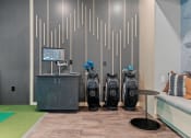 Thumbnail 43 of 76 - golf clubs in our golf simulator room at The Lodge in Rochester Minnesota