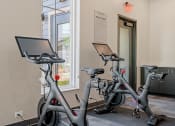 Thumbnail 51 of 76 - a room with two exercise bikes at The Lodge at Overland, Rochester, MN, 55901