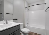 Thumbnail 62 of 76 - a bathroom with a bathtub toilet and sink at The Lodge at Overland, Minnesota