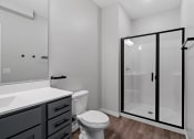 Thumbnail 66 of 76 - a bathroom with a toilet sink and shower at The Lodge at Overland, Minnesota