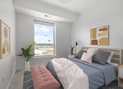 Thumbnail 11 of 83 - a bedroom with a bed and a window