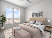 Thumbnail 8 of 83 - a bedroom with a bed and a large window