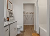 Thumbnail 17 of 42 - a bathroom with a shower and a sink and a toilet at The View on Collins, Michigan