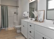 Thumbnail 6 of 79 - a bathroom with a sink and a toilet and a shower at The Commons at Rivertown, Grandville, MI, 49418