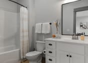 Thumbnail 8 of 79 - a bathroom with a toilet and a sink and a mirror at The Commons at Rivertown, Grandville