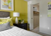 Thumbnail 9 of 30 - a bedroom with a bed and a closet