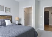 Thumbnail 6 of 30 - a bedroom with a large bed and a closet at Park 205, Park Ridge, 60068