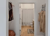 Thumbnail 76 of 83 - A white door with a curtain and a rug on the floor.