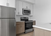 Thumbnail 26 of 83 - Stainless steel appliances at The Hallon II luxury apartments in Hopkins, MN