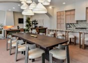Thumbnail 39 of 83 - A modern dining room with a large table and chairs.