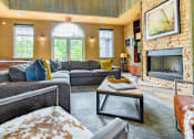Thumbnail 31 of 43 - a living room with couches a coffee table and a fireplace  at Riverset Apartments, Tennessee, 38103