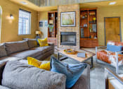 Thumbnail 32 of 43 - a living room with a fireplace and couches  at Riverset Apartments, Memphis
