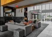 Thumbnail 21 of 42 - a living room with couches and a fireplace at The View on Collins, Lansing, 48910