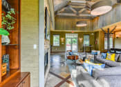 Thumbnail 33 of 43 - a living room filled with furniture and a fire place at Riverset Apartments in Mud Island, Memphis, TN