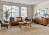 Thumbnail 4 of 22 - Westerville, OH Pet-Friendly Apartments - Kenyon Square - Furnished Living Room with Plush Carpet Flooring, Large Windows, and 9’ Ceilings