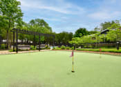 Thumbnail 34 of 43 - a putting green at Riverset luxury apartments in Memphis, Tennessee