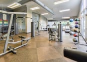 Thumbnail 36 of 43 - a workout room with weights and other exercise equipment  at Riverset Apartments, Tennessee, 38103