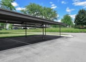 Thumbnail 24 of 30 - a parking lot with a canopy over it