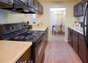 Thumbnail 20 of 43 - our apartments showcase a modern kitchen at Riverset Apartments in Mud Island, Memphis, TN