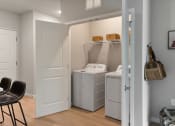 Thumbnail 12 of 62 - a laundry room with a washer and dryer at The Aurilla apartments in Cottage Grove, MN