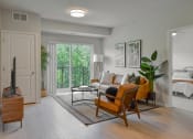 Thumbnail 4 of 62 - Living room with balcony at The Aurilla, Cottage Grove, Minnesota