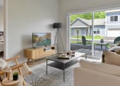 Thumbnail 3 of 76 - a living room with a couch and a coffee table and a television at The Lodge at Overland, Rochester, MN