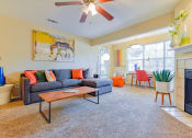 Thumbnail 16 of 43 - a living room with a couch coffee table and fireplace at Riverset Apartments in Mud Island, Memphis, TN
