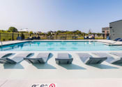 Thumbnail 15 of 16 - Pool area at Velo Village Apartments, Franklin, Wisconsin