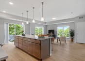 Thumbnail 13 of 62 - Living Room With Kitchen at The Aurilla, Cottage Grove, 55016