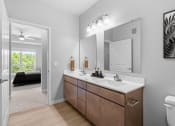 Thumbnail 25 of 62 - a bathroom with a large mirror and a sink at The Aurilla, Minnesota, 55016
