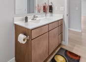 Thumbnail 20 of 62 - a bathroom with a white sink and a mirror at The Aurilla, Cottage Grove