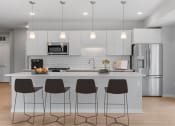Thumbnail 15 of 62 - Kitchen With Island at The Aurilla, Cottage Grove, Minnesota