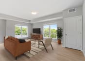 Thumbnail 16 of 62 - Living Room With a Couch at The Aurilla, Cottage Grove, 55016