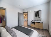 Thumbnail 51 of 79 - Bedroom and spacious closet with access to living room at The Commons at Rivertown, MI