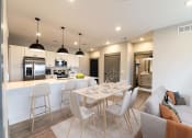Thumbnail 75 of 79 - Open Concept Kitchen, Dining & Living Room at The Commons at Rivertown, Grandville, MI, 49418