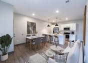 Thumbnail 33 of 79 - an open living room and kitchen at The Commons at Rivertown, Grandville, MI