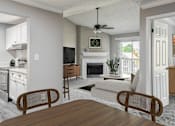 Thumbnail 10 of 43 - A modern kitchen with a dining table and chairs.